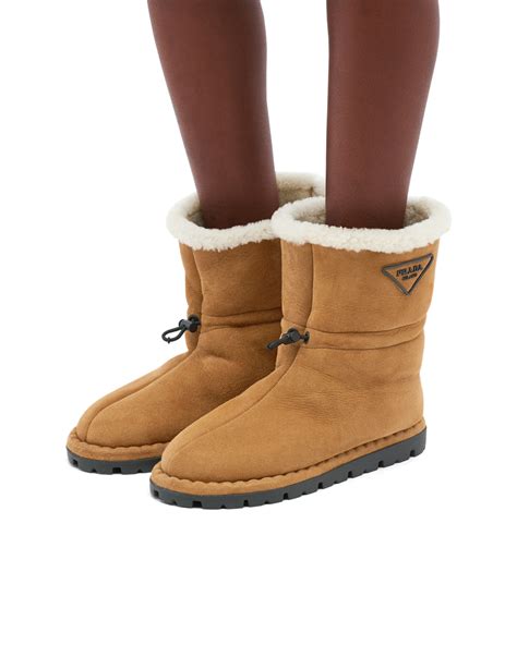 03197 prada boots|Cognac Shearling booties .